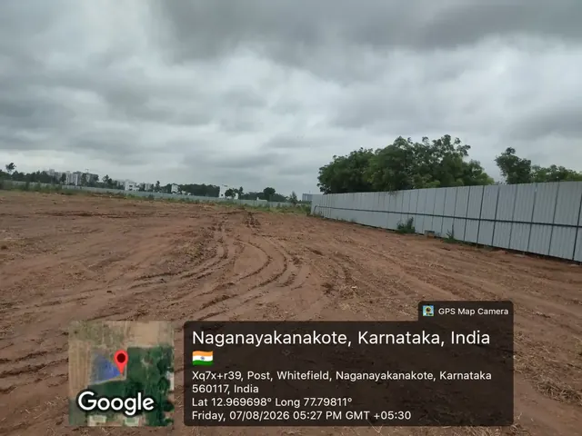 Cleared and levelled land inside the boundary hoarding at the Godrej Florenne site on Soukya Road, off Whitefield, photographed on 7 August 2026